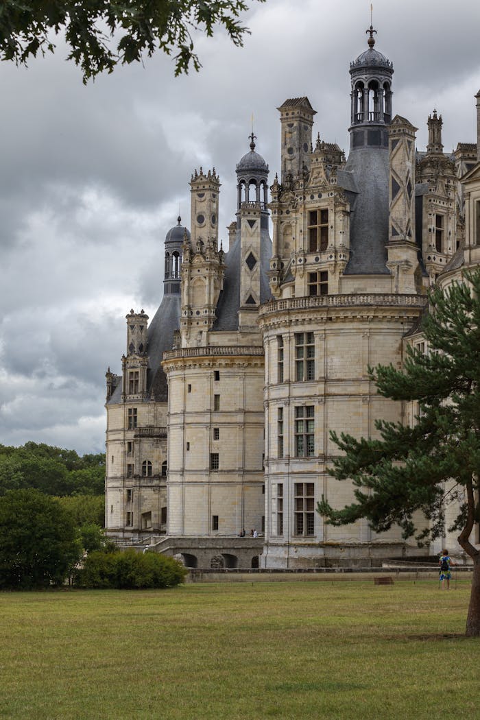 Renaissance architecture of Château de Chambord, France captured on a cloudy day.